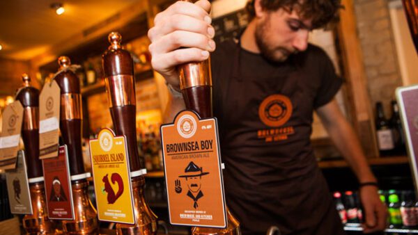 Shop the Exclusive Arsenal Emirates Stadium Tour Package with Gourmet Burger and Craft Beer Flight at Brewhouse and Kitchen for Two